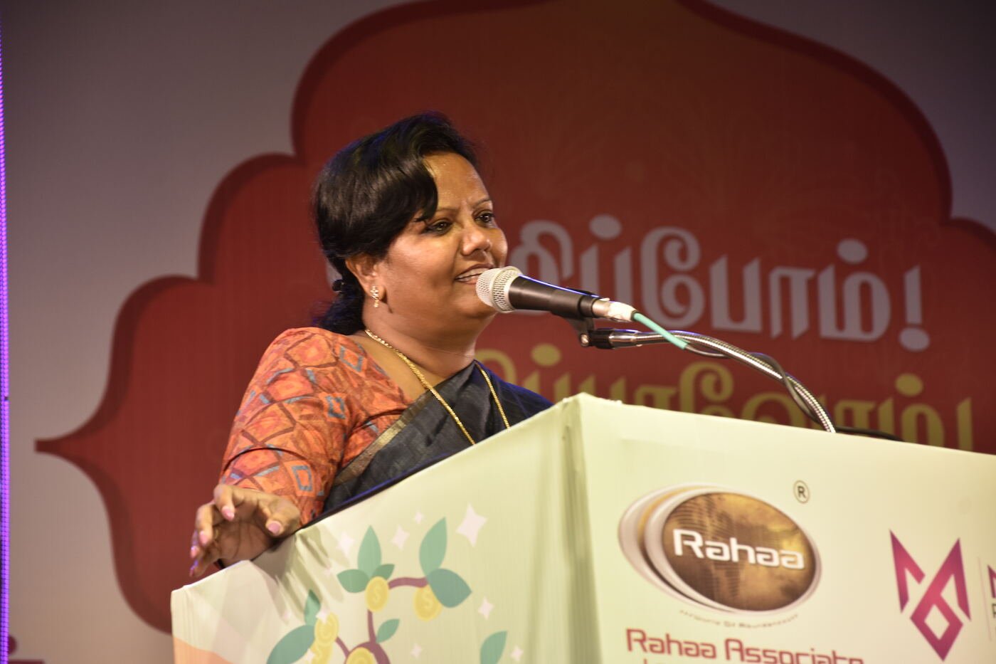 Associate sharing her experience on mic